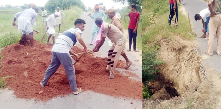 सेवादारों ने सड़क पर बने गड्ढ़ों को मिट्टी से भरा