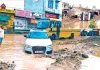 Rain News: पहली बारिश में भूना की निकासी व्यवस्था बदहाल, धंसी सड़क पर पलटा रेत से भरा ट्राला, 7 वाहन फंसे