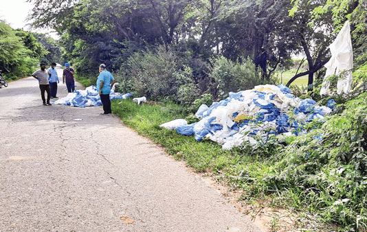 Conspiracy to spread corona infection, heaps of PPE kits found on roadside