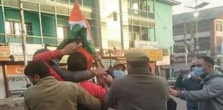 BJP Worker Hoisting Flag