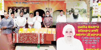 Sadh Sangat of Block Malout distributed stationery and clothes to children
