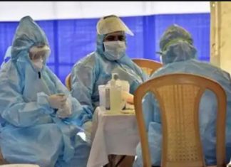 Health workers put a black badge on duty in Haryana